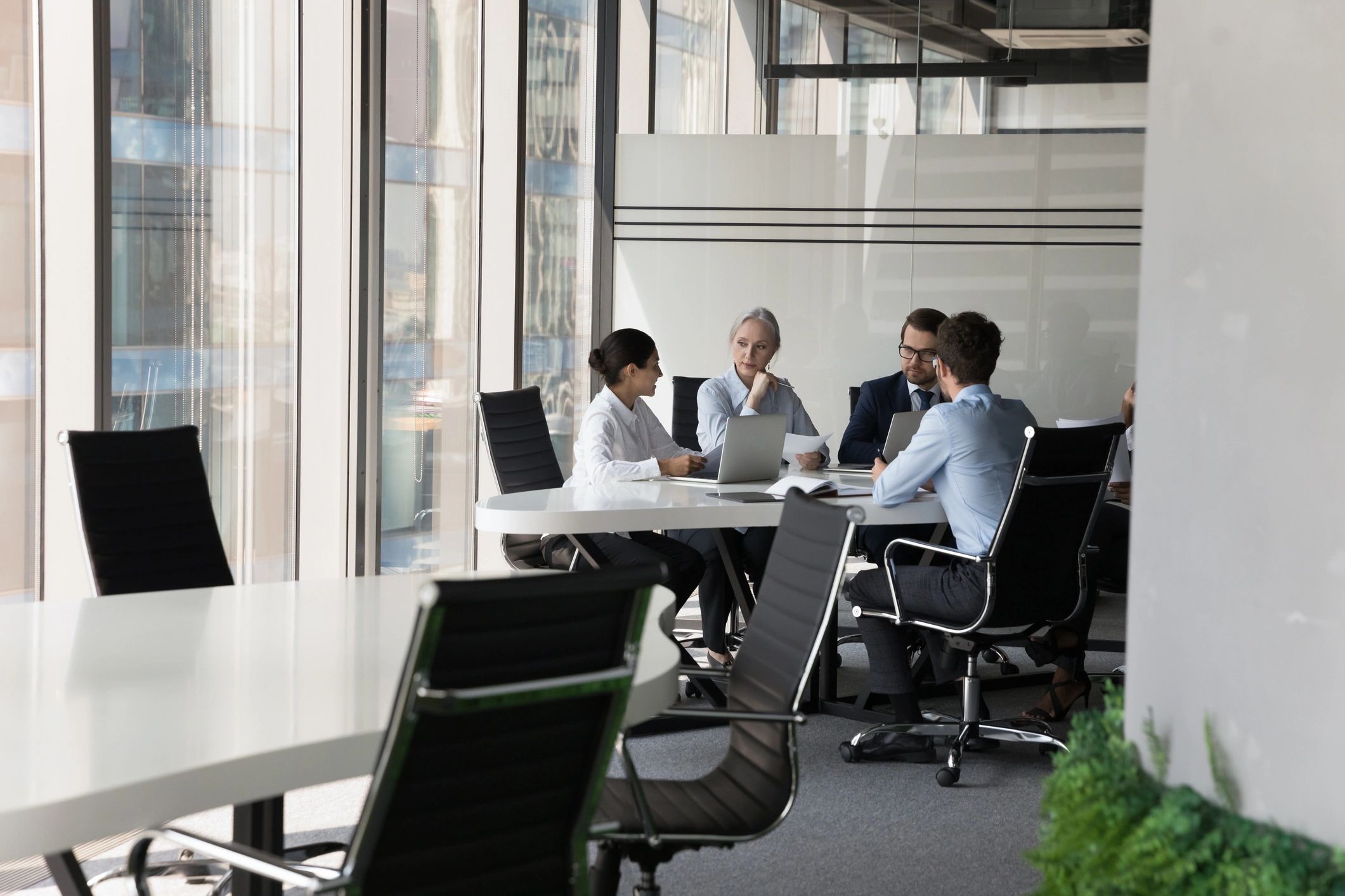 Business group discussing a project around a table