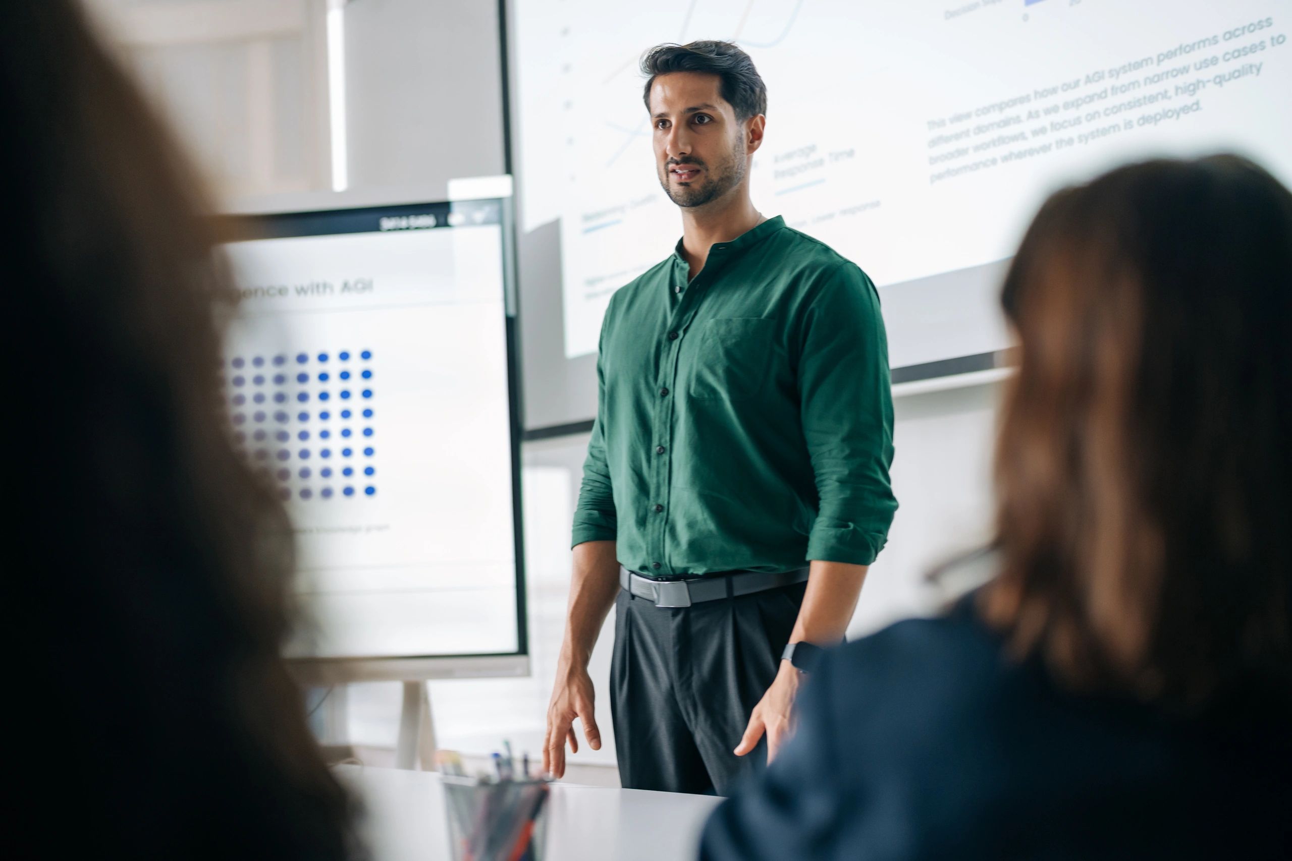 Executive presenting data during a team meeting